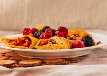 A low carb plate of crepes with berries.