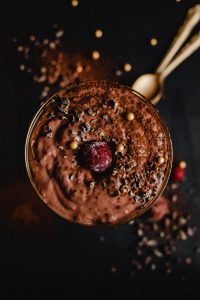 Low carb dessert that's chocolaty and in a cup garnished with chocolate pieces - sugar free.
